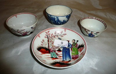 Lot 9 - A Newhall teabowl and saucer, a Caughley teabowl and a famille rose tea bowl (4)
