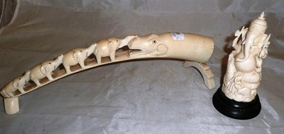 Lot 28 - Carved ivory elephant tusk and a carved figure