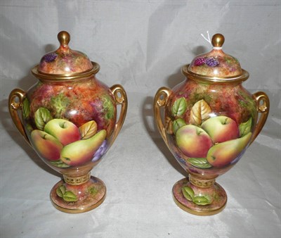 Lot 41 - A pair of Baroness fine china fruit painted twin handled urns, painted by J.Mattram - 23cm high