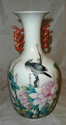 Lot 50 - Famille rose vase decorated with a bird and red handles