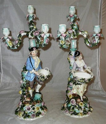 Lot 52 - A pair of Sitzendorf figural three branch candelabrum