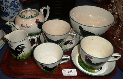 Lot 65 - A Robert Heron "Wemyss Ware" part teaset, each piece painted with black cockerels and hens,...