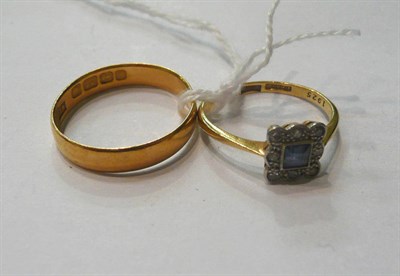 Lot 126 - A sapphire and diamond ring and a 22ct band (2)