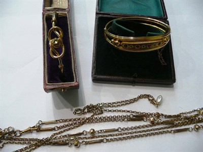 Lot 133 - Two bangles and assorted chains