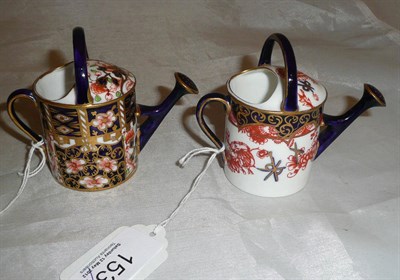 Lot 153 - Two Royal Crown Derby miniature watering cans