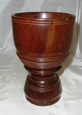 Lot 204 - A large treen mortar, 23cm high