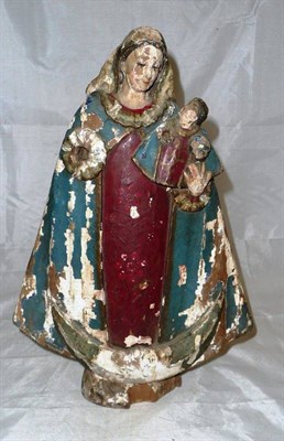 Lot 212 - A polychrome carved wooden figure of the Madonna and child