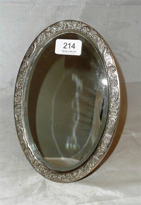 Lot 214 - A silver mounted oval bevelled mirror, 20th century