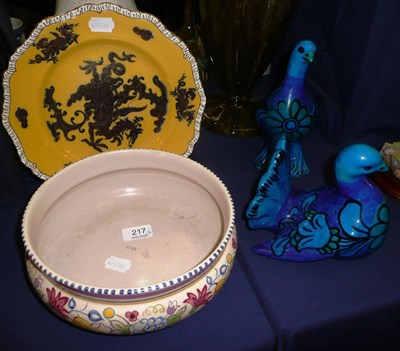 Lot 217 - Two Italian blue glazed birds, Poole pottery bowl and a gilt and dragon decorated plate (4)