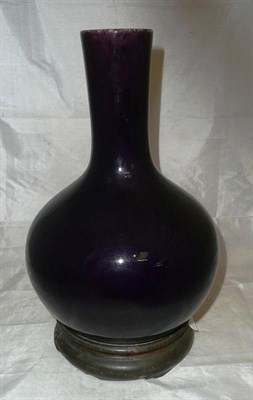 Lot 220 - A Chinese purple bottle vase on stand