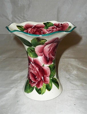 Lot 223 - A Robert Heron "Wemyss Ware" vase, of waisted form with wavy rim, painted with full blown pink...