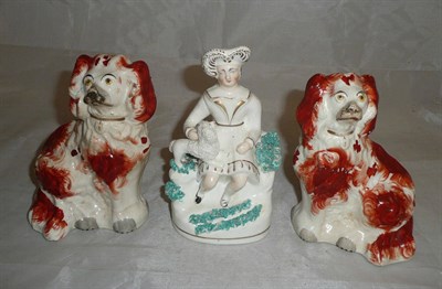 Lot 230 - Pair of Staffordshire spaniels and figure of a boy with dog