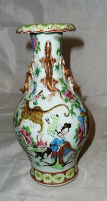 Lot 237 - A Chinese famille rose Canton vase decorated with tiger, deer and figures