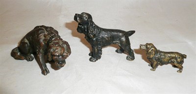 Lot 246 - Three small bronze cast figures of Spaniel dogs (two previously mounted), 6cm, 4cm and 3cm high