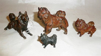 Lot 250 - Four bronze figures of Pomeranian dogs, of tapering size, the largest 7cm high