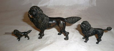 Lot 258 - Three bronze figures of graduated size of Poodles, largest 8cm high