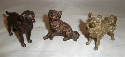 Lot 259 - Three bronze figures of dogs, largest 7cm high