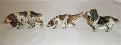 Lot 264 - Three cold painted bronze Spaniel dogs, two 4.5cm high and one smaller 3.5cm high