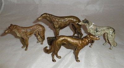 Lot 272 - Two bronze figures of Borzoi dogs and two cast figures of Borzoi dogs (previously mounted),...