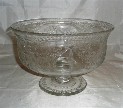 Lot 298 - A large engraved glass pedestal punch bowl, 20th century, of circular form with everted rim,...