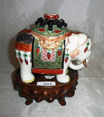 Lot 322 - Japanese porcelain ceremonial elephant and wooden stand