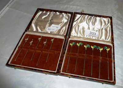 Lot 333 - Five sterling cocktail sticks and six sterling and enamel cocktail sticks, cased