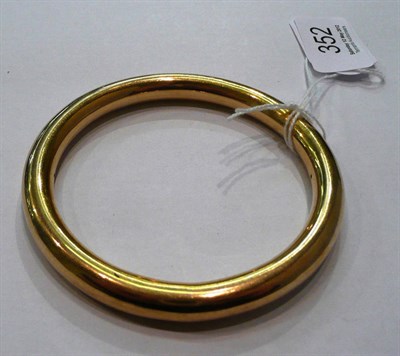 Lot 352 - A 9ct gold bangle