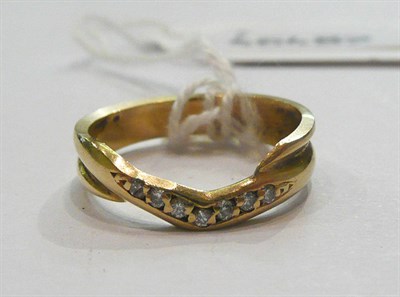 Lot 367 - An 18ct gold shaped band ring, set with diamonds