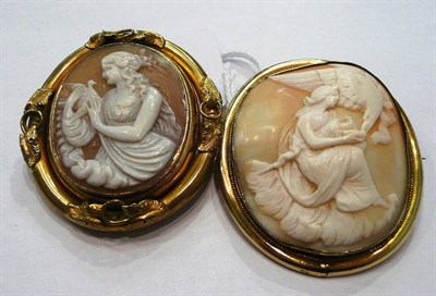 Lot 370 - Two cameo brooches, one an oval shell cameo depicting a lady with an eagle, within a plain...