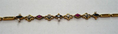 Lot 384 - A ruby, sapphire, diamond and seed pearl bracelet (a.f.)