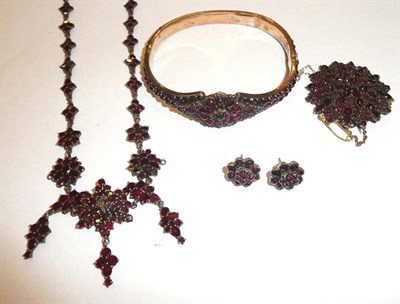 Lot 467 - A 19th century garnet set suite of jewellery comprising necklace, bangle brooch and earring