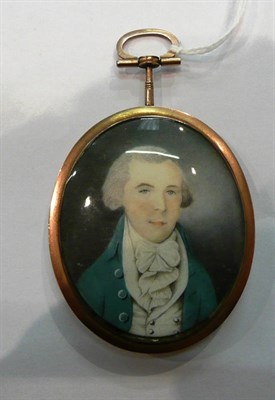 Lot 473 - An early 19th century miniature of a gentleman, with hair work back