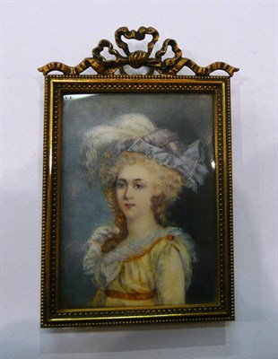 Lot 483 - A portrait miniature of a young lady in a gilt frame