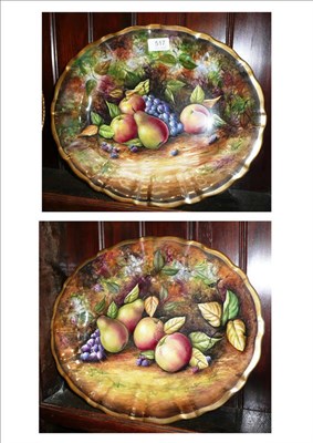 Lot 517 - A Baroness fine china pair of platters, painted by J.Mattram, 38cm wide