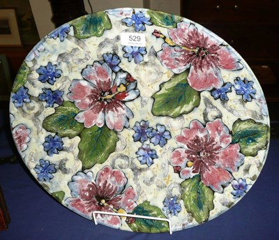 Lot 529 - A Dartington pottery Hawaiian print stoneware dish, painted with hibiscus, impressed factory...