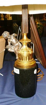 Lot 533 - Granite based lamp with cherub mounted on gilt column with shade