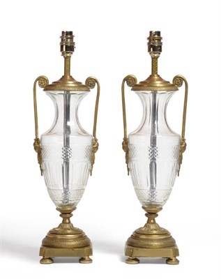 Lot 553 - Pair of gilt metal and cut glass table lamps