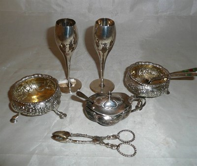 Lot 559 - A pair of silver Georgian salts, silver salt, two tea spoons, two silver spill vases and sugar nips