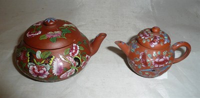 Lot 562 - Two Chinese terracotta and polychrome painted miniature tea pots, one lacking handle