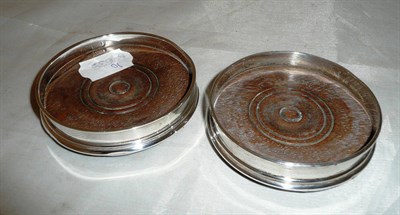 Lot 564 - Pair of silver glass coasters