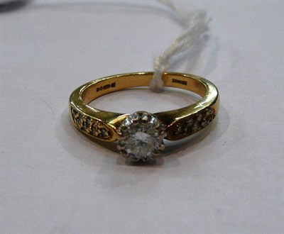 Lot 580 - An 18ct gold diamond solitaire ring with diamond set shoulders, principal diamond weight 0.33 carat