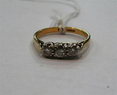 Lot 582 - An 18ct gold diamond three stone ring