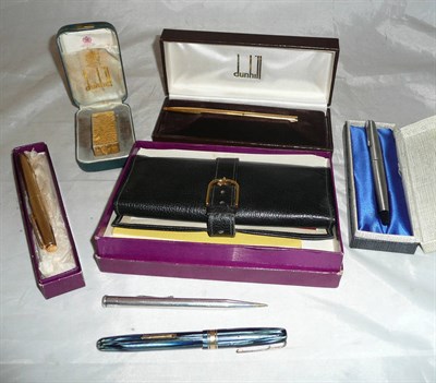 Lot 584 - An Asprey fountain pen, an Asprey backgammon set, a Dunhill lighter, a pen, a Parker pen,...