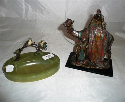 Lot 589 - An cold painted bronze and onyx ashtray and a spelter table lighter in the form of a camel