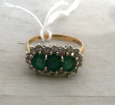 Lot 595 - A 9ct gold emerald and diamond triple cluster ring