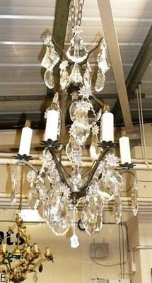 Lot 606 - A metal and cut glass ceiling chandelier