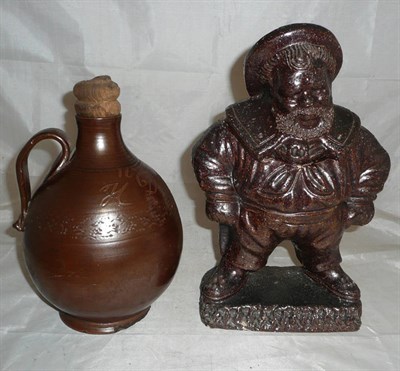 Lot 627 - A 19th century salt glazed tobacco jar in the form of a sailor and a stoneware flagon dated...