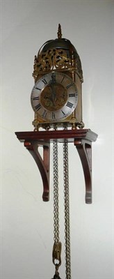 Lot 639 - A 20th century lantern clock and wall bracket