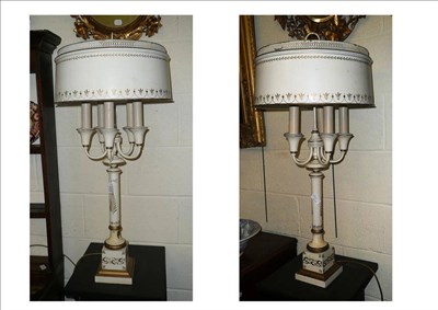 Lot 644 - A pair of white painted five branch table lamps and shades