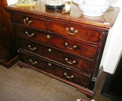 Lot 646 - A George III mahogany chest of drawers, late 18th century with fluted pilasters